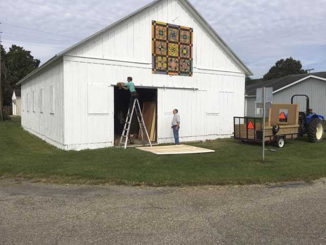 barn, people painting barn