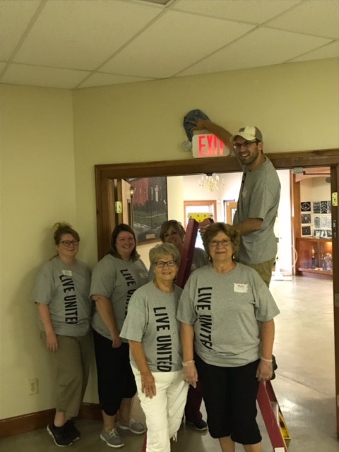 united way community cares event people cleaning