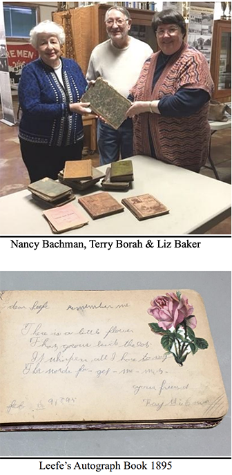 group of people looking at historical documents